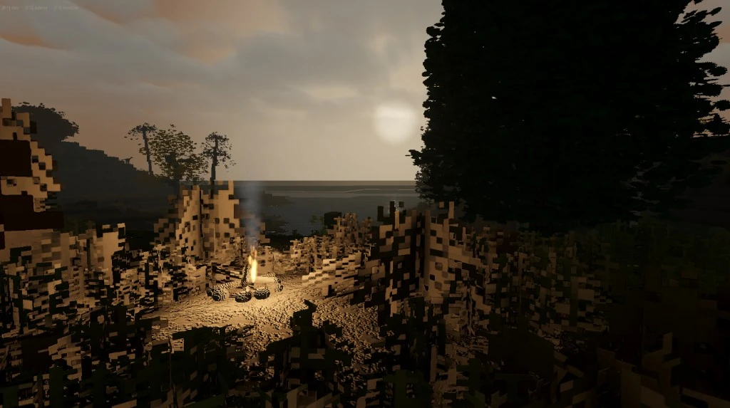 A small campfire burning among dry scrub on a beach at dusk, with the sun low over the sea behind