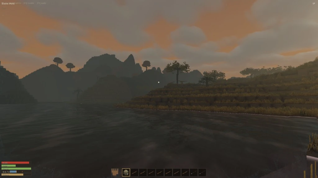 A lake at sunset with dark hills behind, grassy terraces on the far shore and the survival bars and hotbar along the bottom of the screen